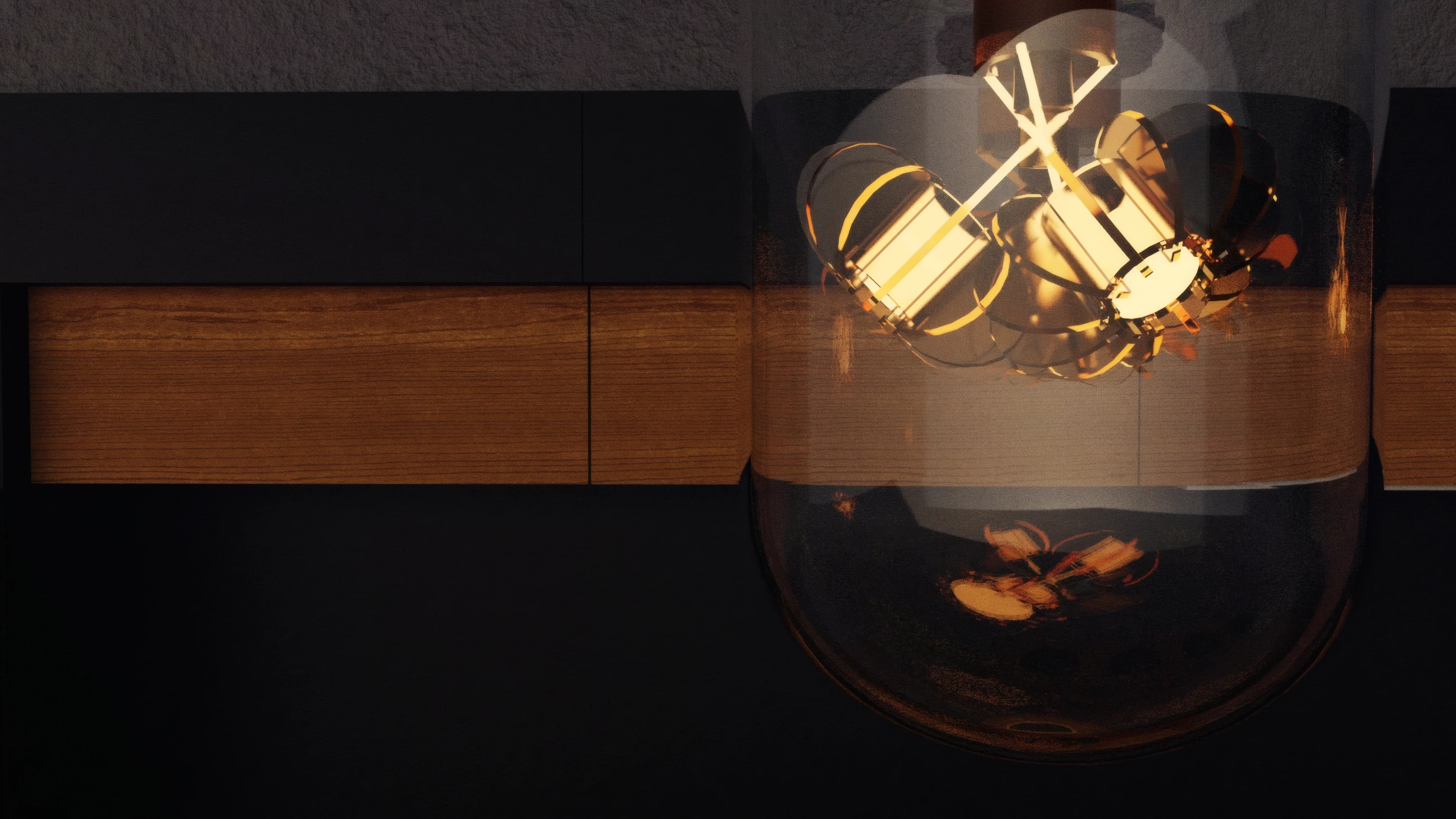 A sculptural orange filament suspended inside a clear glass bulb