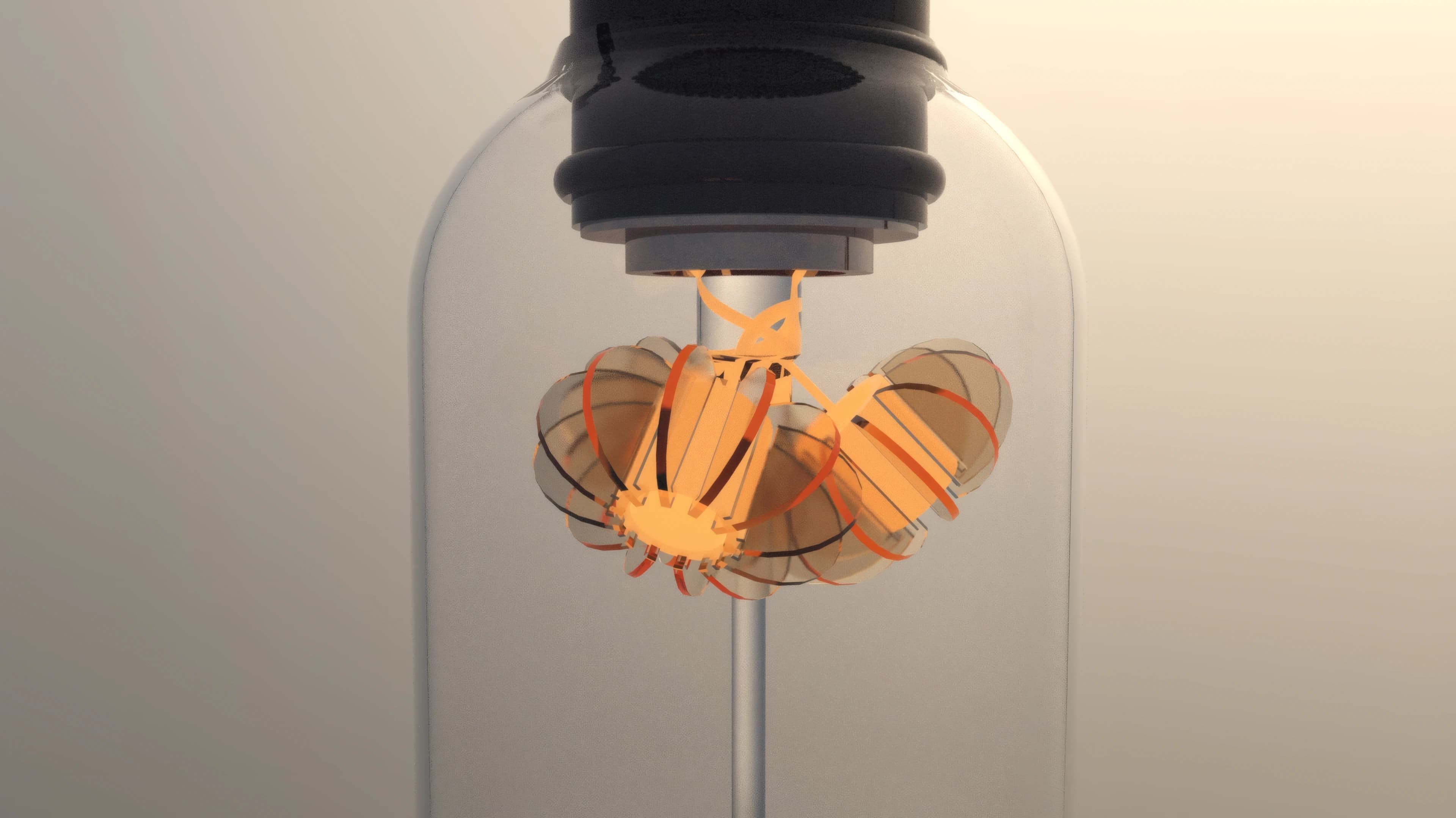 The folded amber filament seen through the glass bulb in soft light