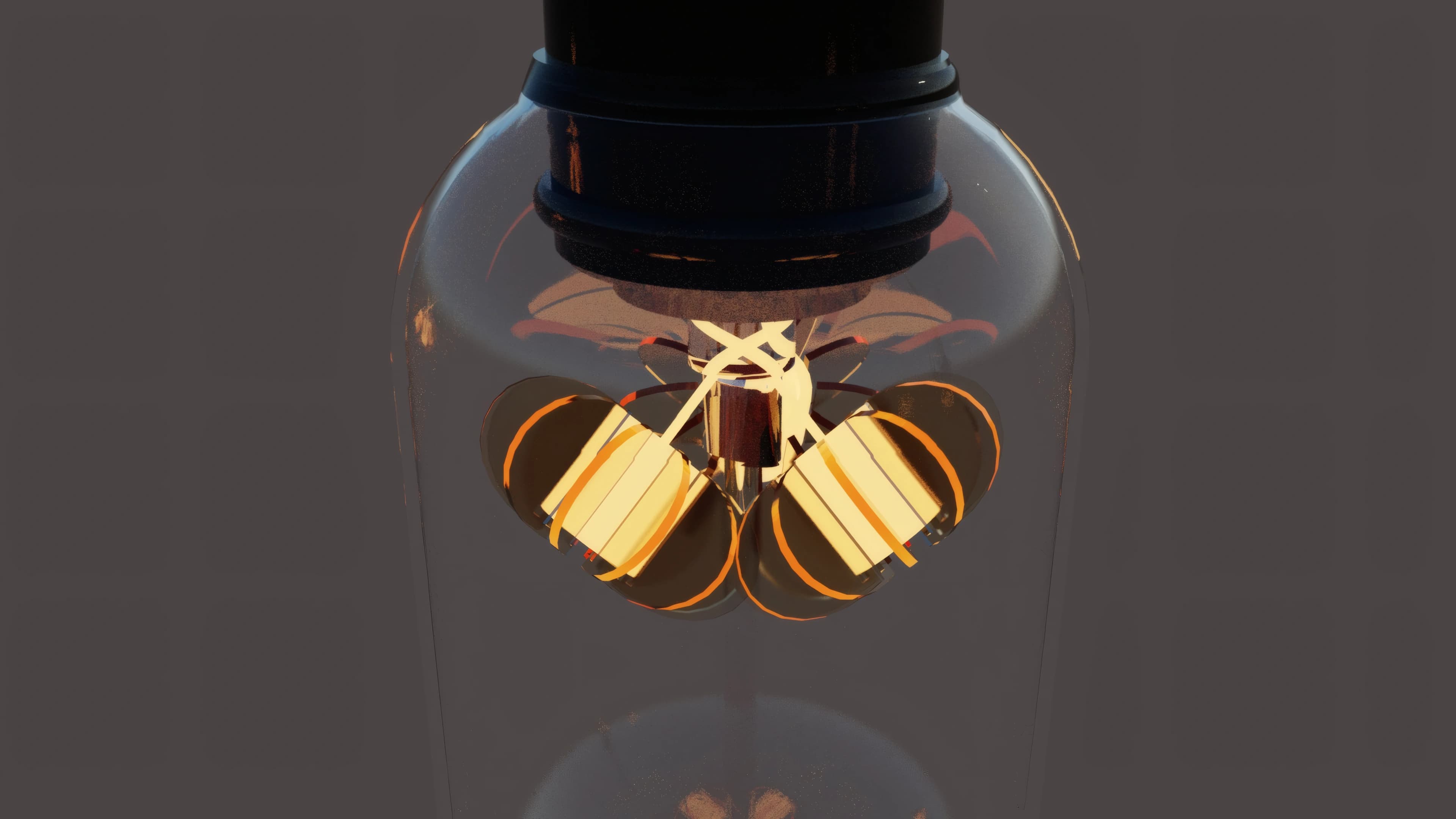 A dark studio view of the glowing folded filament